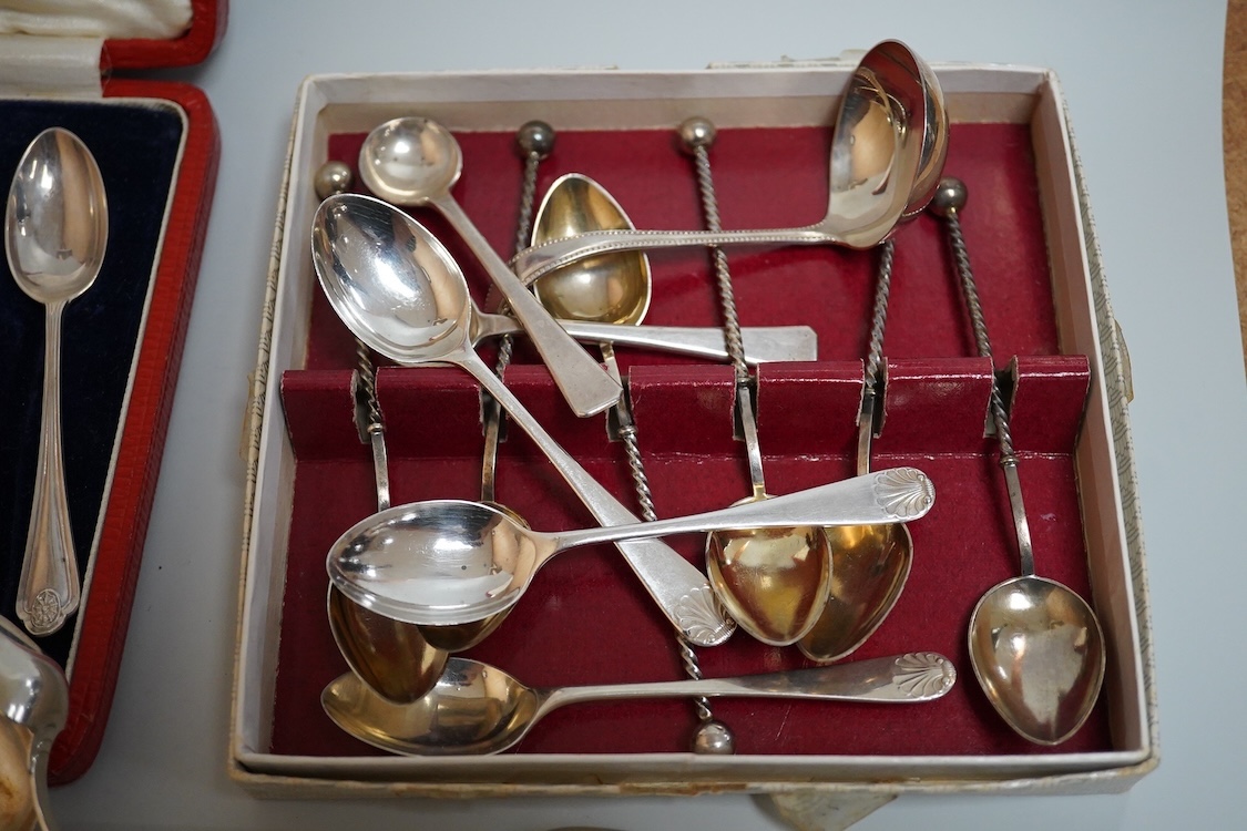 A cased set of five(ex 6) silver teaspoons and pair of sugar tongs, a set of six shell end coffee spoons, five other silver items of flatware, a boxed set of six 830 standard white metal teaspoons, an 800 standard shovel